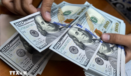 Đồng USD chịu sức ép do nguy cơ thương chiến Mỹ-Trung leo thang